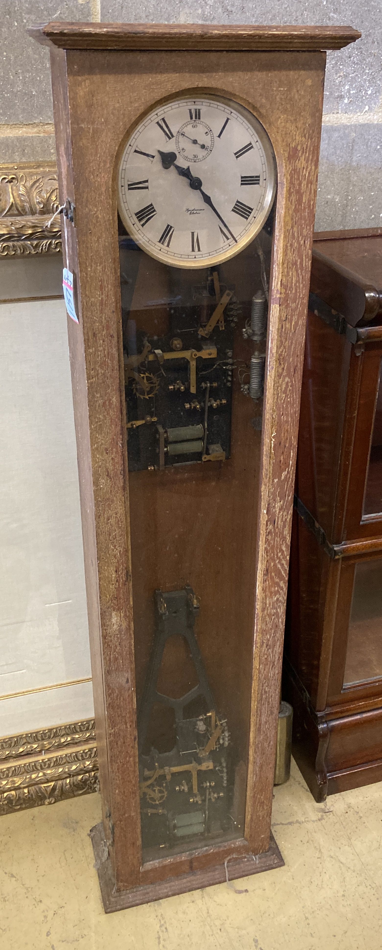 A Synchronome electric oak cased pendulum master clock, height 128cm